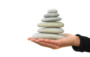 Stacked rocks to symbolize Lean and Six Sigma foundation.